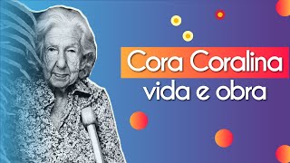 Cora Coralina ao lado do escrito"Cora Coralina vida e obra".