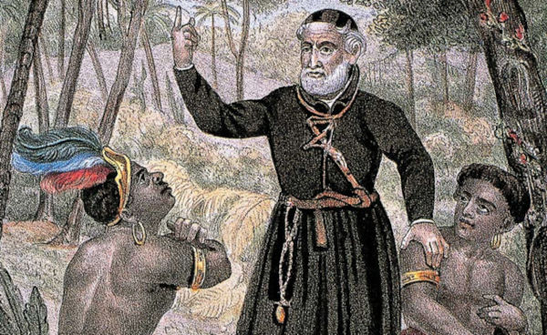 Na gravura, jesuíta falando aos indígenas, parte da história da língua portuguesa no Brasil.