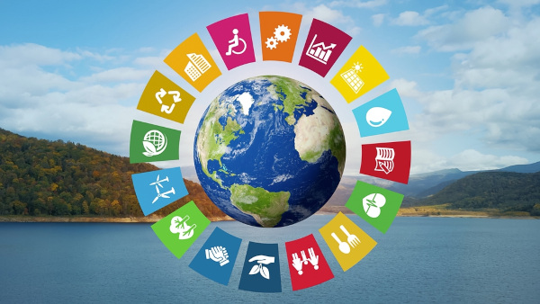 Ícones que representam objetivos da Agenda 2030 em torno do planeta Terra.