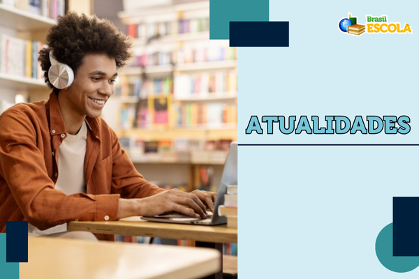 Jovem estudando atualidades para os vestibulares e para o Enem.